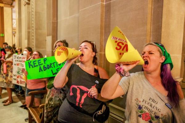 Abortion rights activists chant slogans as the Indiana Senate debates before voting to ban abortion during a special session in Indianapolis in June. 