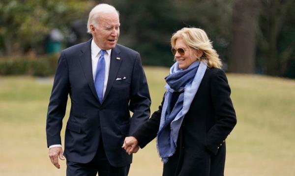 President Joe Biden and first lady Jill Biden arrive on the South Lawn of the White House, Monday, Jan. 23, 2023, in Washington. (AP Photo/Evan Vucci)