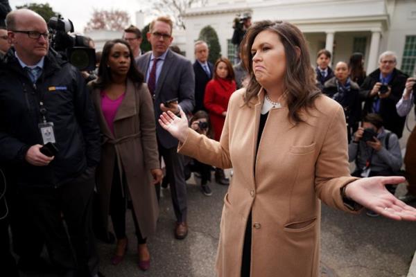 White House press secretary Sarah Huckabee Sanders talks to journalists outside the West Wing of the White House in April 2019.
